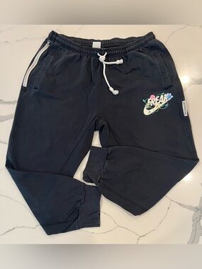 Nike Black Joggers with White Drawstring and Multicolor Floral Logo